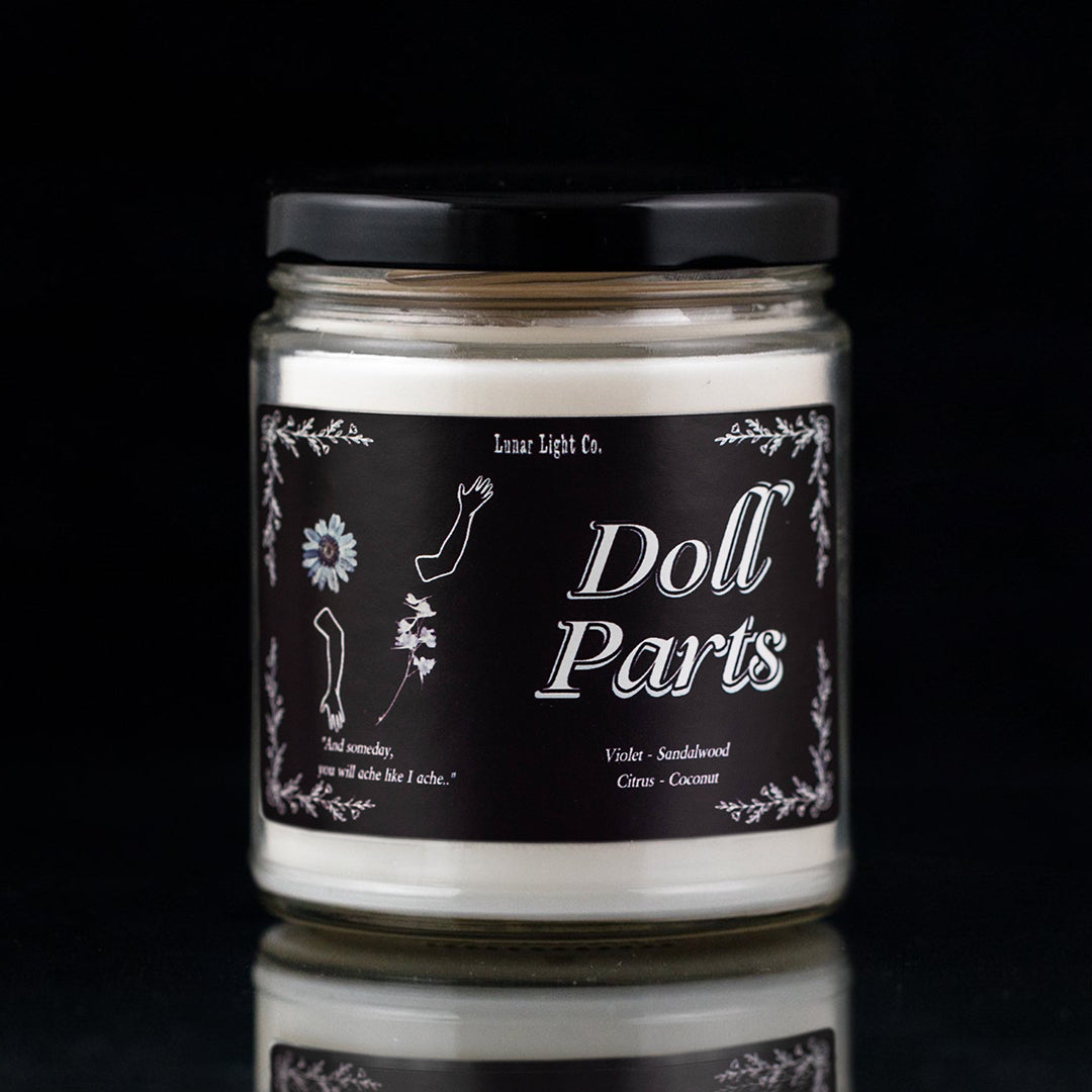 Doll Parts Candle on Black background