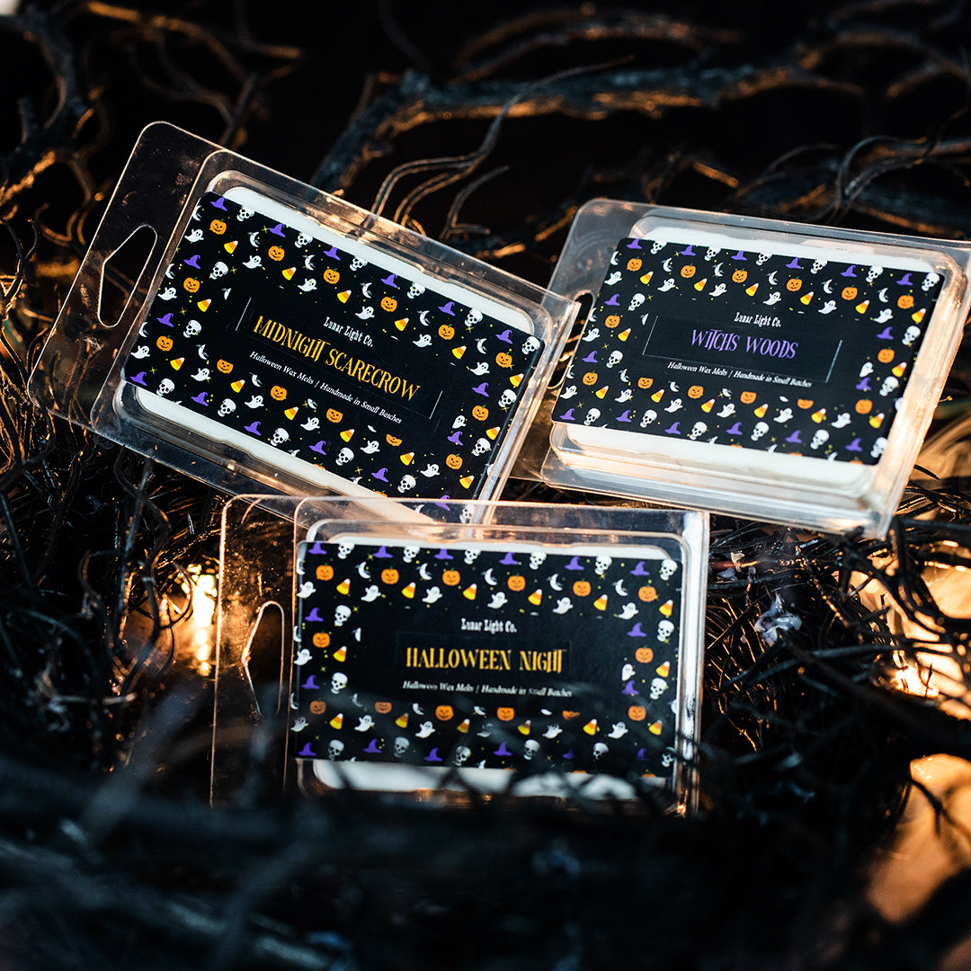 3 halloween wax melt packages on creepy background