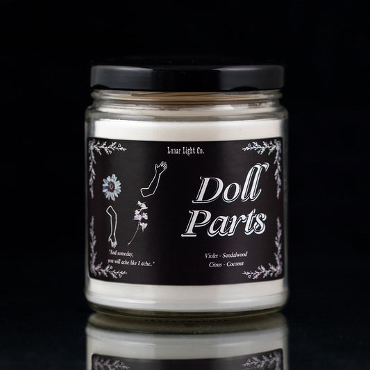 Doll Parts Candle on Black background