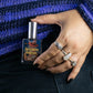 Halloween Forever Spray bottle in hand with spooky rings