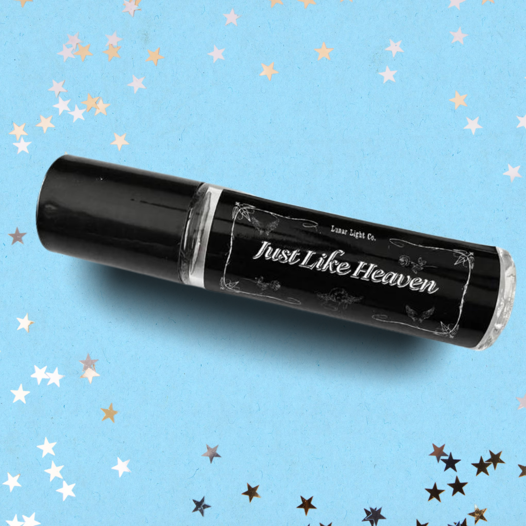 Just Like Heaven Perfume Oil bottle on Blue Background with stars
