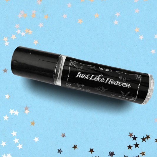 Just Like Heaven Perfume Oil bottle on Blue Background with stars