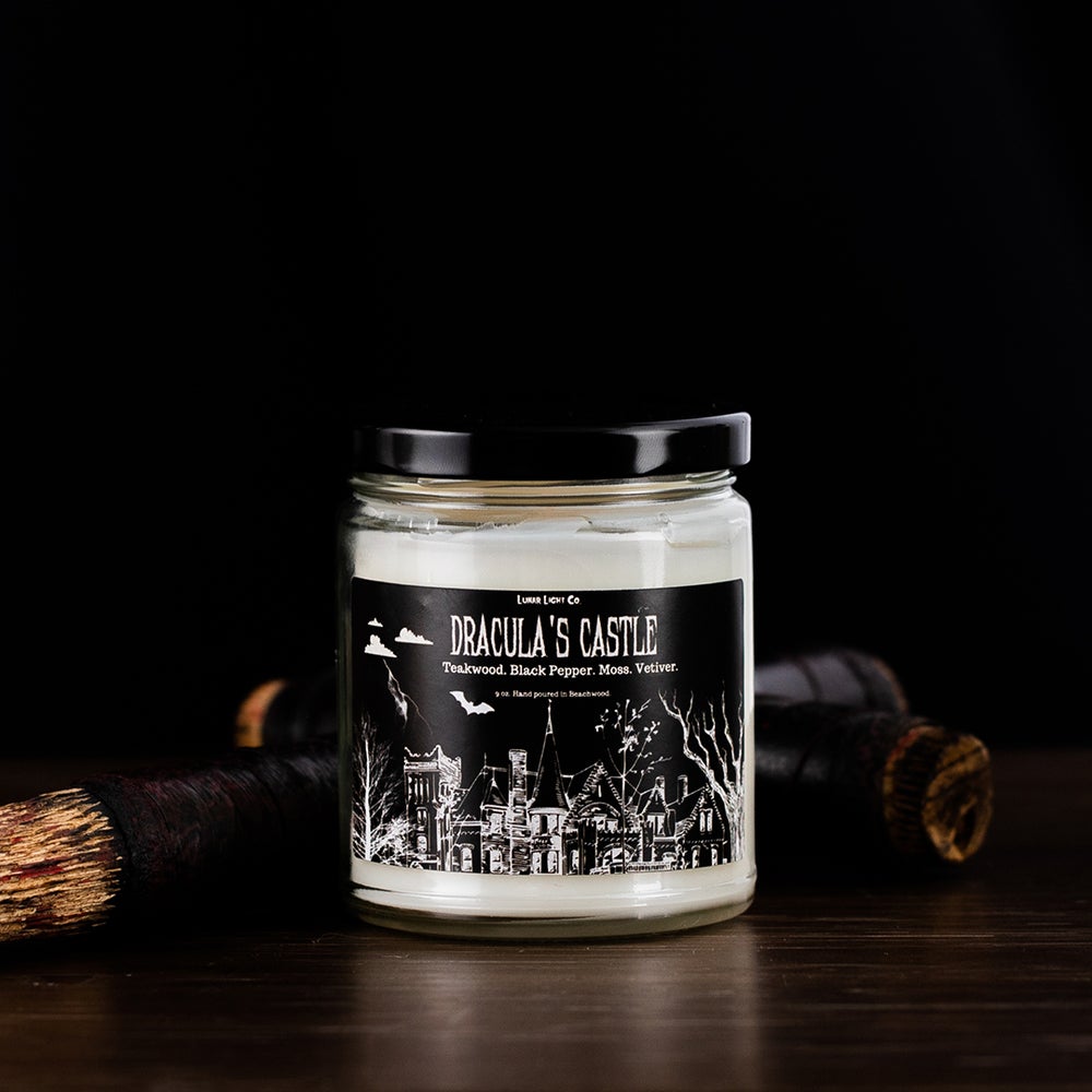 draculas castle candle on table with wooden stake