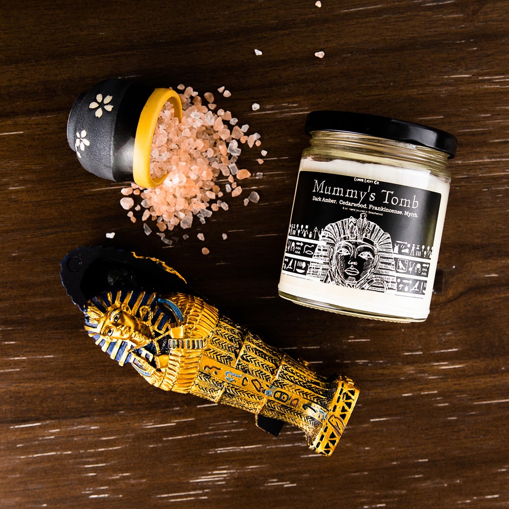 mummys tomb candle flat lay with frankincense and king tuts tomb