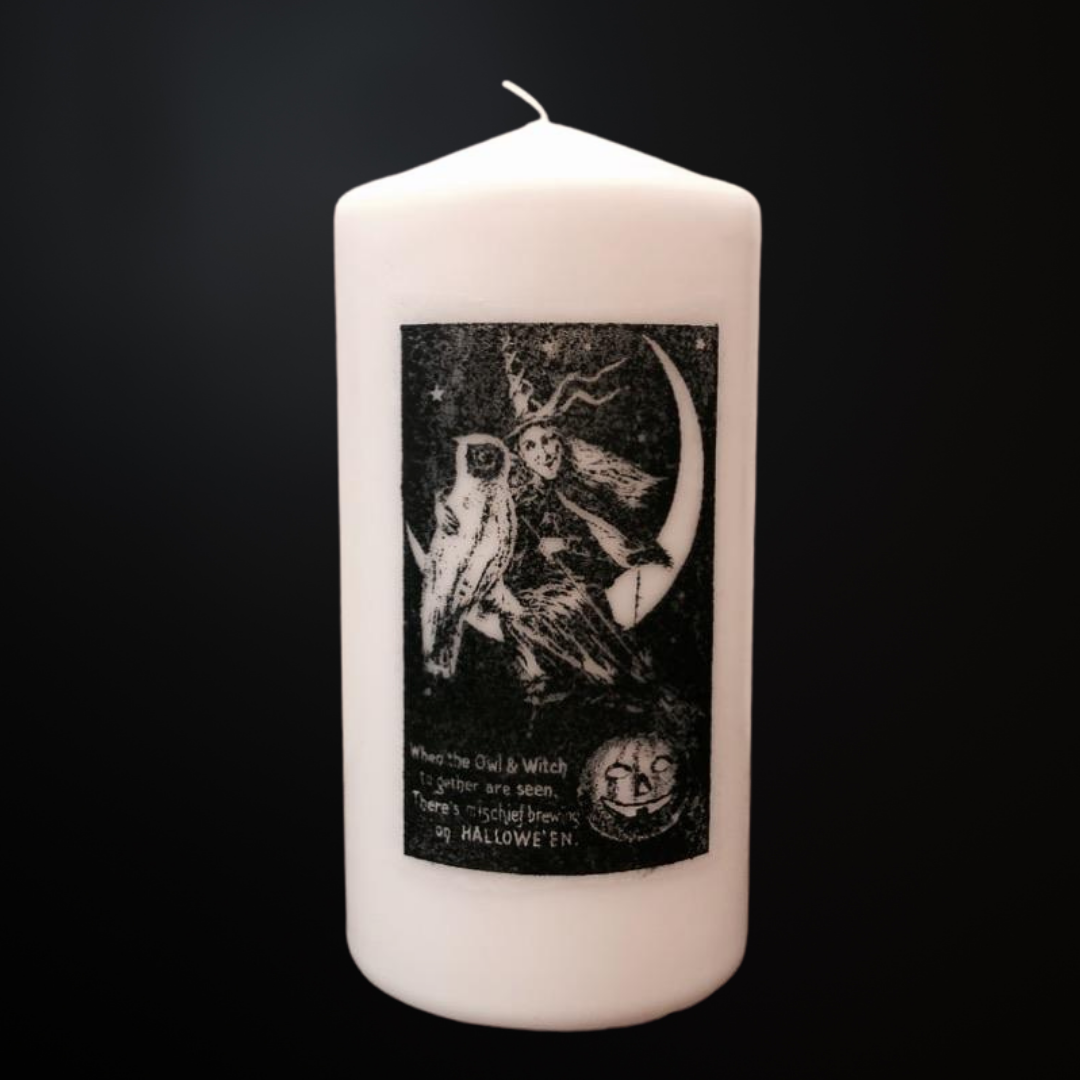 vintage halloween candle with witch and owl, white pillar candle with illustration